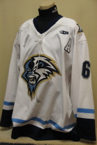 Fight strap.Travis Winter #6 Indiana Ice 2004-05 White #6. This one was worn by defenseman Travis Winter during the inaugural season of the Indiana Ice USHL hockey team. This size 58 by SP has great wear. Also has alternate captain "A" with SP logo on left chest and Ice patches on both shoulders.
