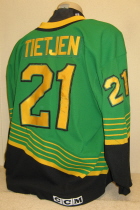Nick Tietjen Away #21 1996-97 This one was worn during the 96-97 season by Nick Tietjen. NOB and yellow on black USHL chest patch. This away sweater is made by CCM and is a size 52.
