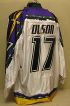 Brett Olson #17 White 2005-06. All-Star - Prospects game Host. Worn by Brett Olson during the 05-06 season. Manufactured by OT Sports, this size 56 shows some wear.All-Star game patch on right chest. The previous season was the first year for this style jersey. 