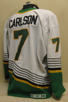Jeff Carlson white #7 1996-97 This one was worn during the 96-97 season by Nick Tietjen. NOB and yellow on black USHL chest patch. This away sweater is made by CCM and is a size 52.