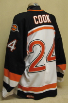 Omaha Lancers Ted Cook 04-05 This white gamer was worn by Trevor Smith. Lancer old logo patches on shoulder, USHL and CCM Tagging on rear hem, NOB. Shows nice wear. Made by CCM, size 56. 