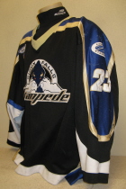 Kevin Huck Sioux Falls Stamepde 2003-04 #12 Worn during the 2002-03 USHL season. Shows great wear. Made by Gemini and is a size 54. NOB, shoulder patches, USHL & Gemini Crest on front. This style of jersey was worn for the first four seasons. 1999-2000 was Sioux Falls' first season in the league.
