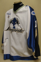 Layne Sedevie 2001-02 Sioux Falls Stampede #1 This jersey was worn by goaltender Layne Sedevie during the 2001-02 season. Shows great wear. Mfg. by Gemini. NOB, shoulder patches, USHL & Gemini crest on front of jersey. This style of jersey was worn for the first four seasons. 1999-2000 was Sioux Falls' first season in the league. 