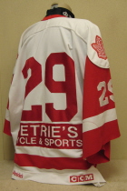 Thunder Bay Flyers Ken Ritson 98-99 white#29. This jersey was worn by first year goaltender Ken Ritson. Size Huge, sleevs cut midway down. Made by CCM this one has NNOB but is sponsored by Perellie's Cycle & Sport on the back. 