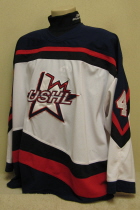 Played in CR. USHL All Star Jersey worn Two NHLer's. This is a home USHL All-star jersey number #4. These were also the jerseys the USHL team wore while representing the USA in the annual 4 Nations Tournament. Worn for two seasons, 99-00 and 00-01, the first season it was worn by now New Jersey Devil David Hale in both his first USHL All-Star game and during the 4 Nations Tournament. The second season it was worn by Tampa Bay draft pick Art Femenella during the USHL All-Star game. It is made by Jamin.