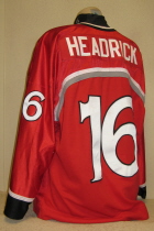 Waterloo BlackHawks #16 2001-02 Red This one was worn during the 2001-02 season by Zac Headrick. BlackHawk alternate logo patches on shoulders. Bauer and USHL logos on chest. This one has tons of wear as it was used for this and the previous season. Manufactured by SP, it is size 56. 