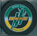 2006-07 Souvenir Pucks available for sale at the team store. Green Top.