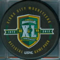 2011-12 40th season OGP different than store puck says USHL Official Game Puck as opposes to the 1972-2012 date on store puck