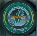 2005-06 Souvenir Pucks. Three different colors were available at the team store, Yellow, Purple & Green.