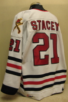 Worn by Michael Stacey during the 01-02 season. Judging by his 6 points and 222 Penalty Minutes, he put to use the two addition fight straps to good use!!! Awesome wear!!! Nike & CHL logos on hem. Memorial "20" on chest 