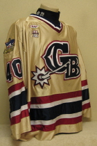 Green Bay Gamblers #40 Bret Adams 2001-02 This jersey is one of my favorites!!! Great logo, tons of wear, awesome colors, all on a dazzle material. This one was worn by Bret Adams during the 01-02 campaign. I think that originally it was a regular gamer, then in the 01-02 season used as the team's alternate jersey. Made by Gemini and is a size 48.