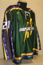Brian Bales 2003-04 Third jersey. This one was worn during the 2003-04 season by Brian Bales. This was the first season in the new Tyson Event Center, a 6500 seat NHL style arena. This season marked the introduction of purple to the traditional Green Yellow Black Musketeer colors as well as a new logo. Made by Gemini and is a size 52