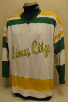 Bogdan Podwysocki #18 1974-75/75-76 These are the second style jersey worn by the Musketeers for 2 seasons. This one was worn by fan favorite Bubba Podwysocki. Originally, these had the traditional circular Tri-State crest. Upon arrival of new Musketeer jerseys for the 76-77 season, these were handed down to the Sioux City High School team, where the front crest was removed and replaced by the generic 