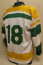 Bogdan Podwysocki #18 1974-75/75-76 These are the second style jersey worn by the Musketeers for 2 seasons. This one was worn by fan favorite Bubba Podwysocki. Originally, these had the traditional circular Tri-State crest. Upon arrival of new Musketeer jerseys for the 76-77 season, these were handed down to the Sioux City High School team, where the front crest was removed and replaced by the generic 