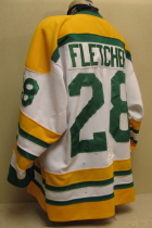 Justin Fletcher #28 2002-03 Throwback Jersey This special throwback jersey (see first season jersey #30) was worn by Justin Fletcher. This commerated 30 years of Musketeer hockey. Used as an alternate, they were raffled of near the end of the season. It is a size 48, made by Gemini. 