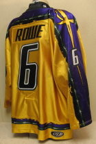 Andrew Rowe #6 Yellow 06-07. This jersey was worn during the 2006-07 season by Andrew Rowe. Manufactured by OT Sports, this size 54 shows nice wear. This was the first season for the yellow jerseys. The Musketeers also wore a special purple jersey for part of the season and a dark green for the road jerseys.