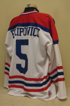 95-96 USHL All-Star Game Jayme Filipowicz This was worn during the USHL All-star game held in Waterloo, Iowa, at the newly opened Young Arena. Worn by Jayme Filipowicz. This all "mesh" jersey is a XXL and is made by Athletic Knits (AK). Screened crest and heat applied numbers & name.