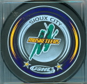 2005-06 Souvenir Pucks. Three different colors were available at the team store, Yellow, Purple & Green.