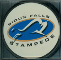 The Stampede is based out of Sioux Falls, South Dakota. These two styles were available through the team store. the black puck is also a game style puck with USHL logo on back, the white one is a souvenir puck with no reverse logo. 2004-05 season marked their fifth year anniversary.