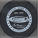 2004-05 Official Game Puck reverse logo. White ring, black letter official game puck. These USHL Official logoed pucks started to phase in during the 04-05 season. It was the main goal to have all the teams using this style puck for games starting the 05-06.